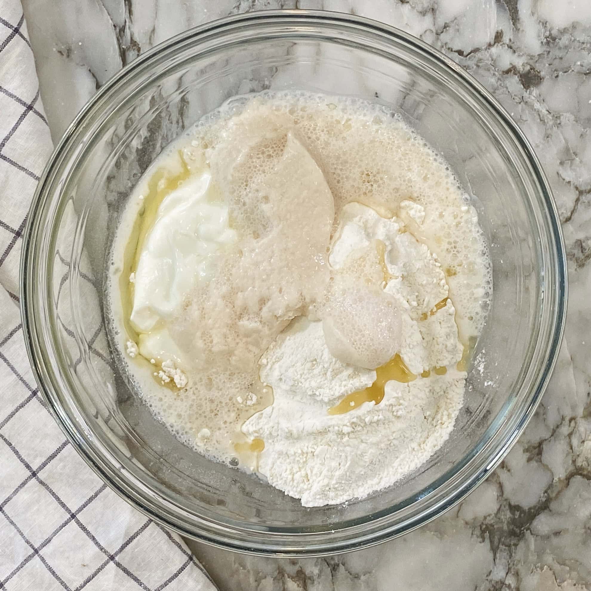 activated yeast, yogurt and oil added to flour