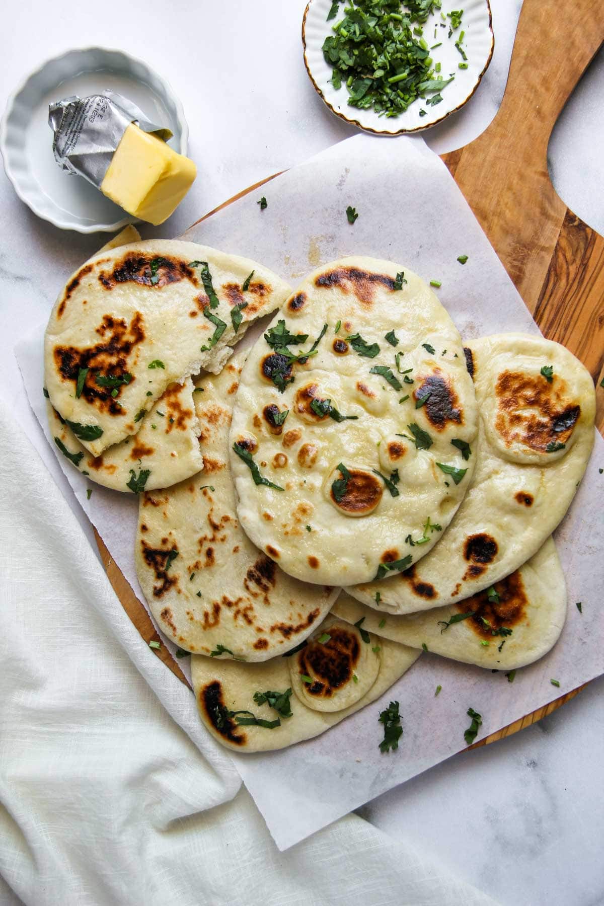 homemade Indian naan with yeast, garnished with cilantro