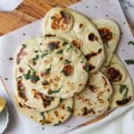 yeast naan garnished with cilantro