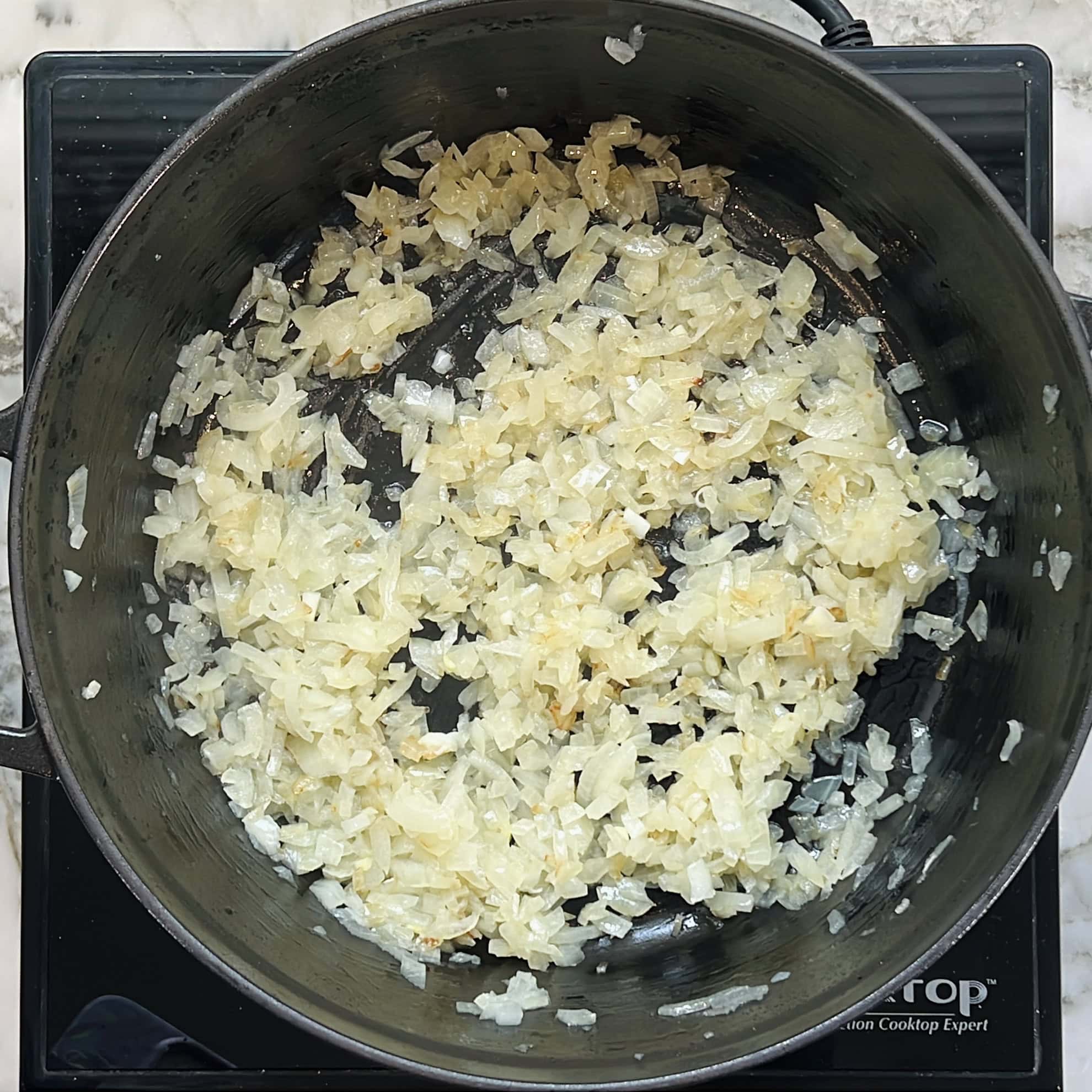 sauteed onions in a pan.