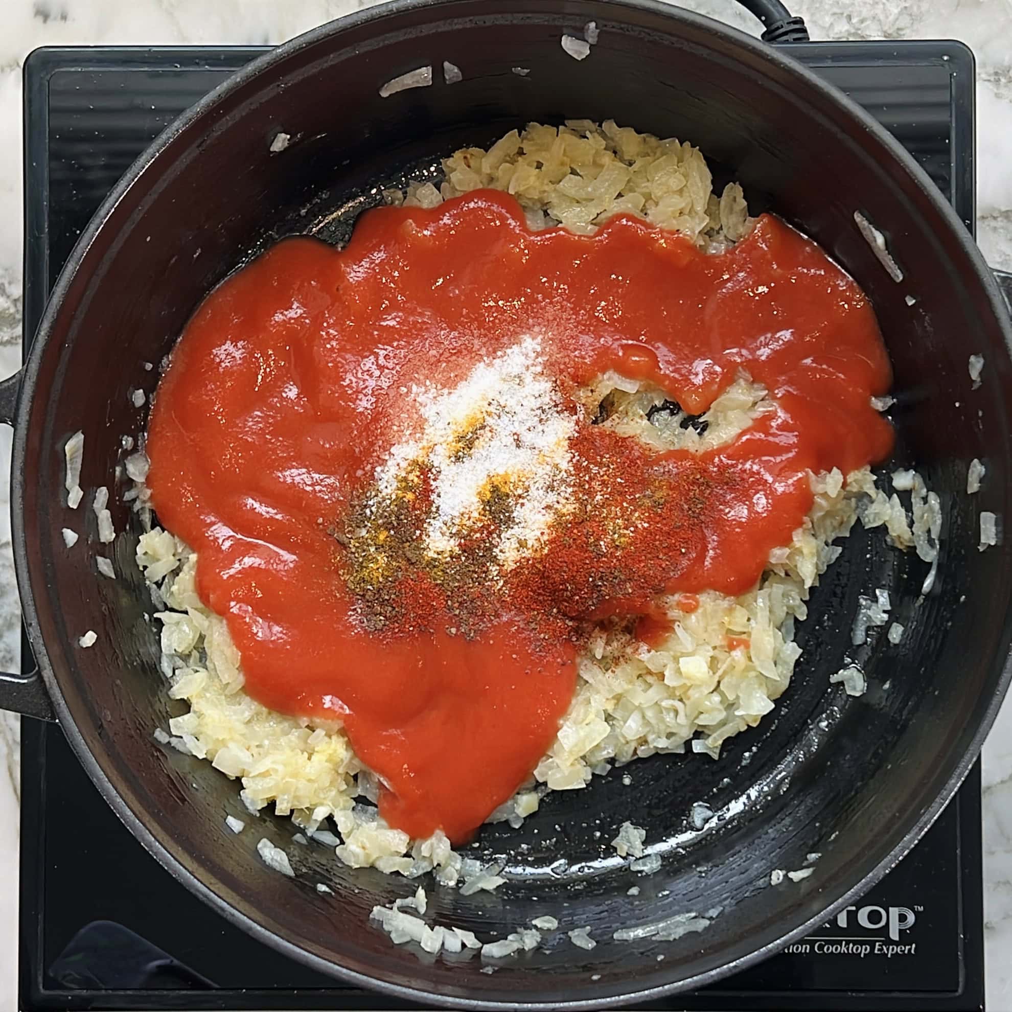 sauteed onions with tomato puree and ground spices.