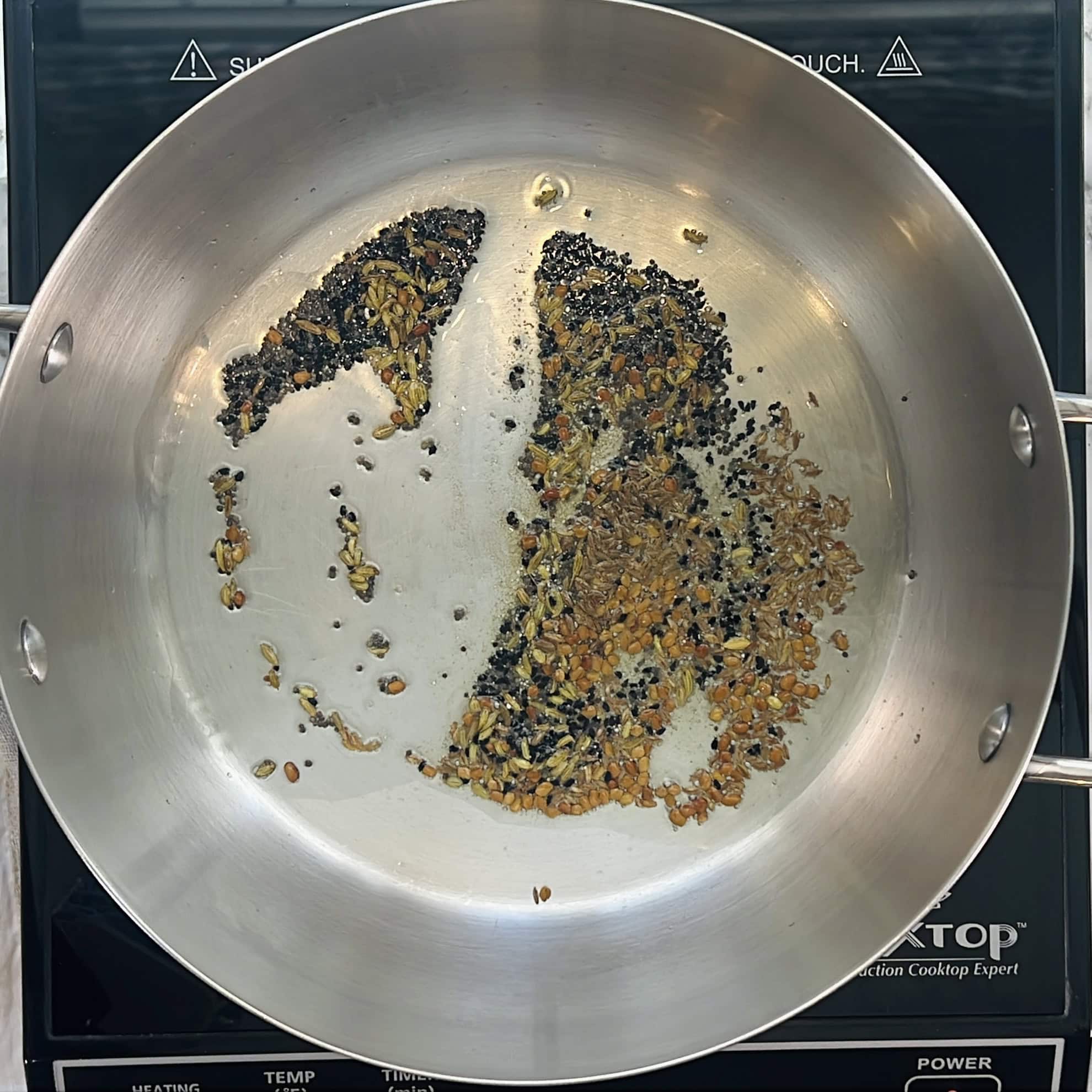 whole spices tempered in oil