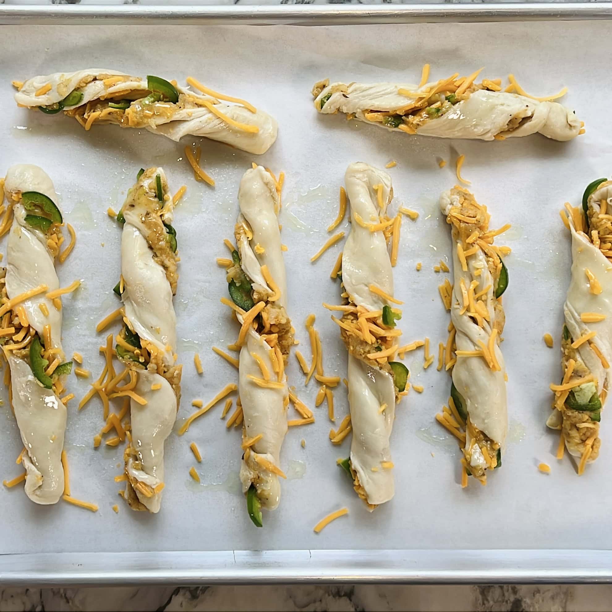 samosa cheese twists on baking tray 