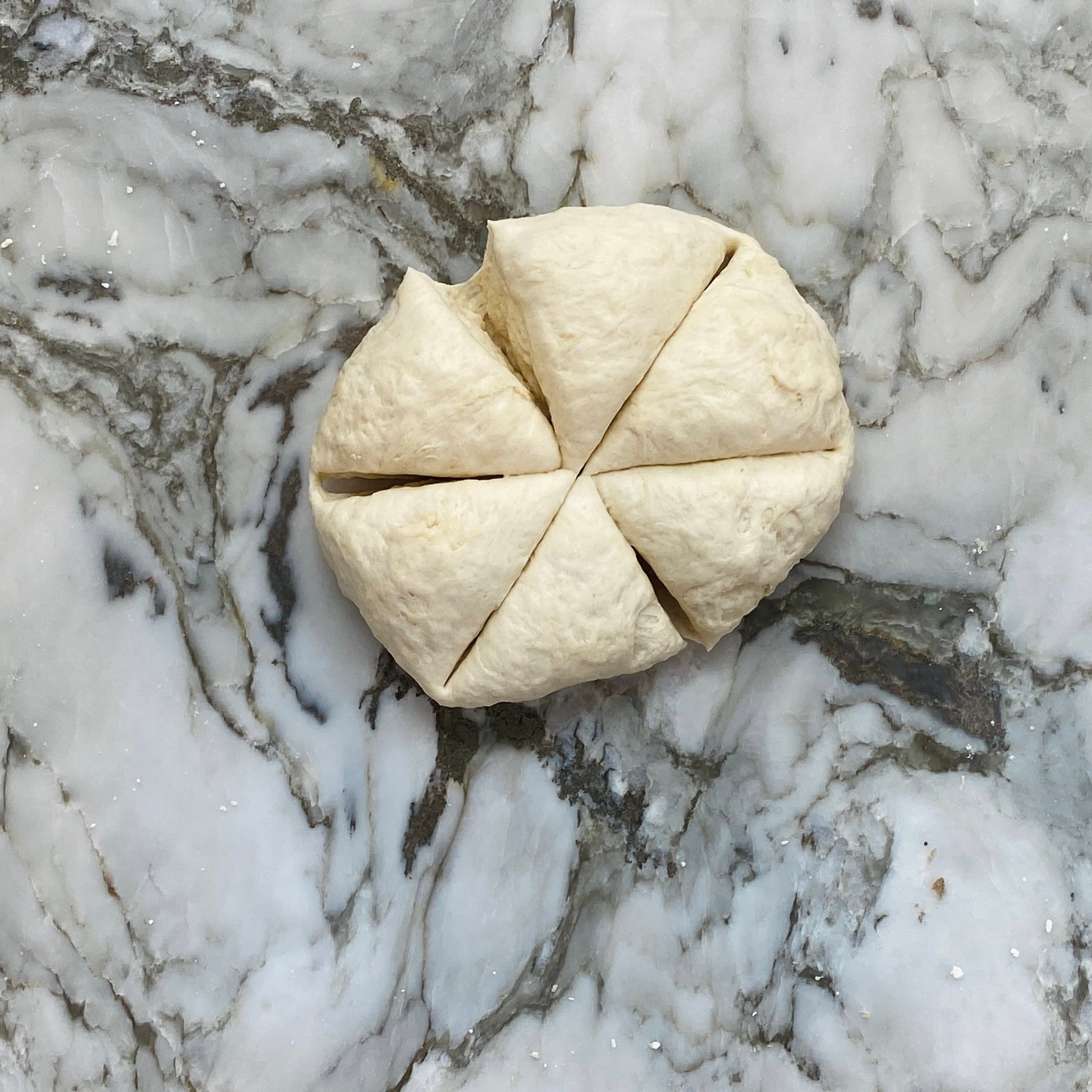 naan dough divided into six parts.