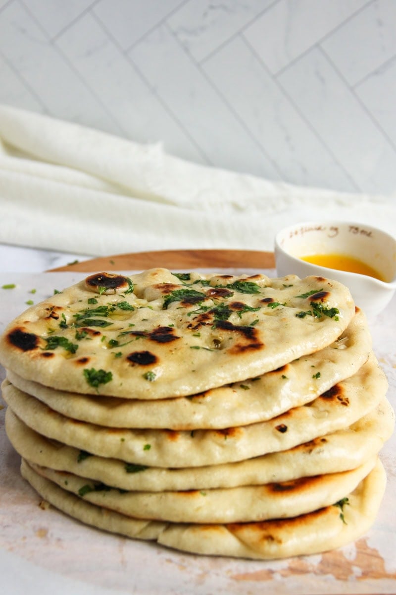 stack on homemade butter garlic naan