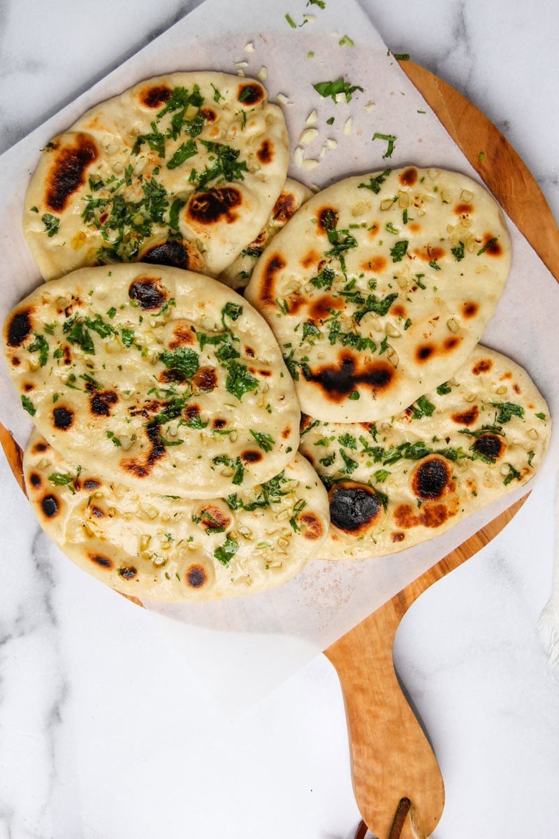 butter garlic naan garnished with cilantro