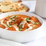 chicken tikka masala in a white bowl