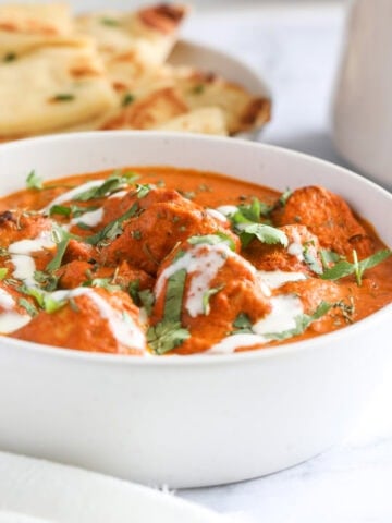 chicken tikka masala in a white bowl