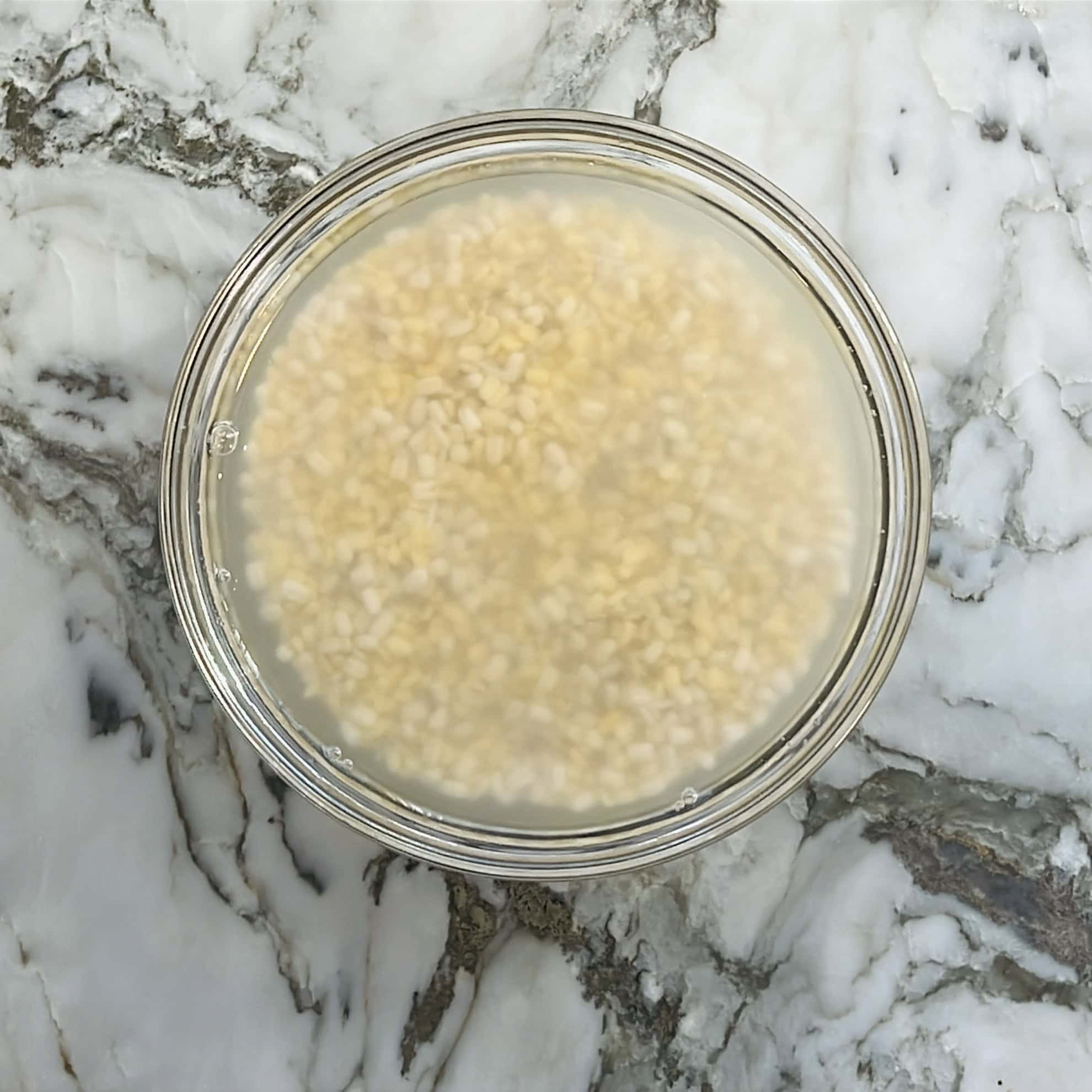 lentils and rice soaking in a bowl.