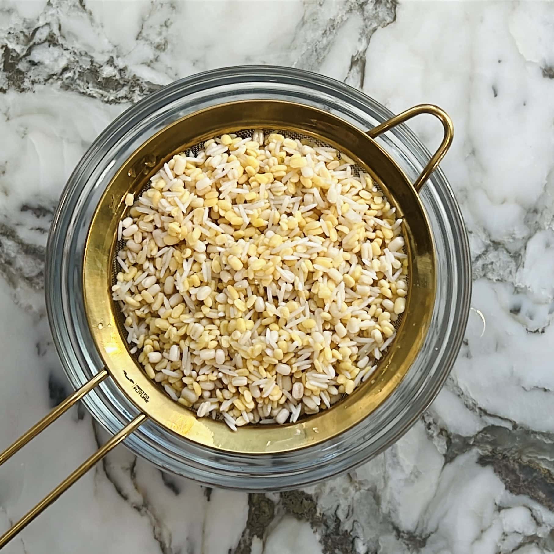 lentils and rice in a strainer.