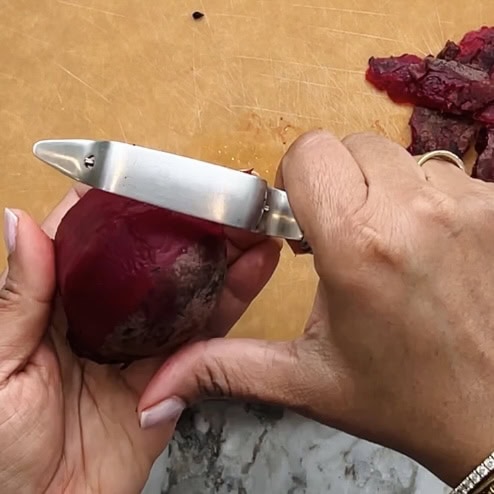 peeling steamed beet.