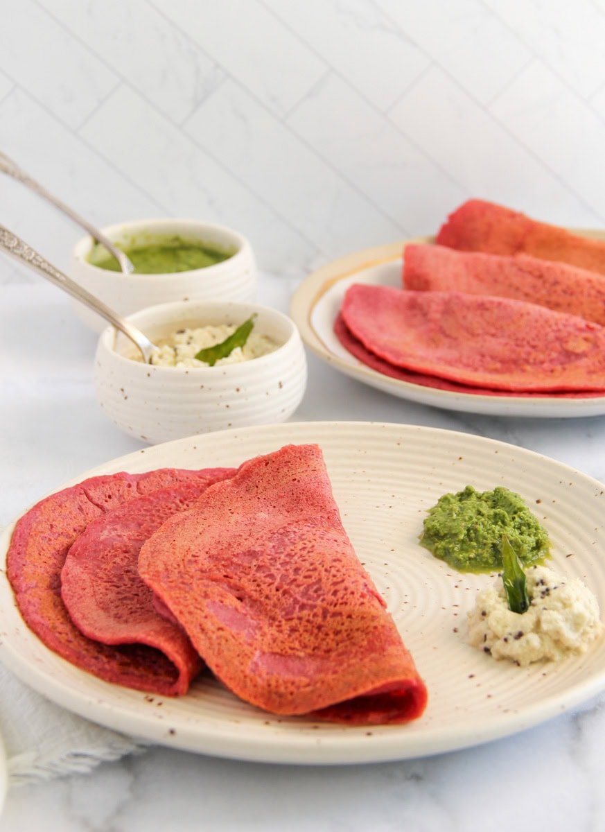 beetroot chillas served with green chutney and coconut chutney. 