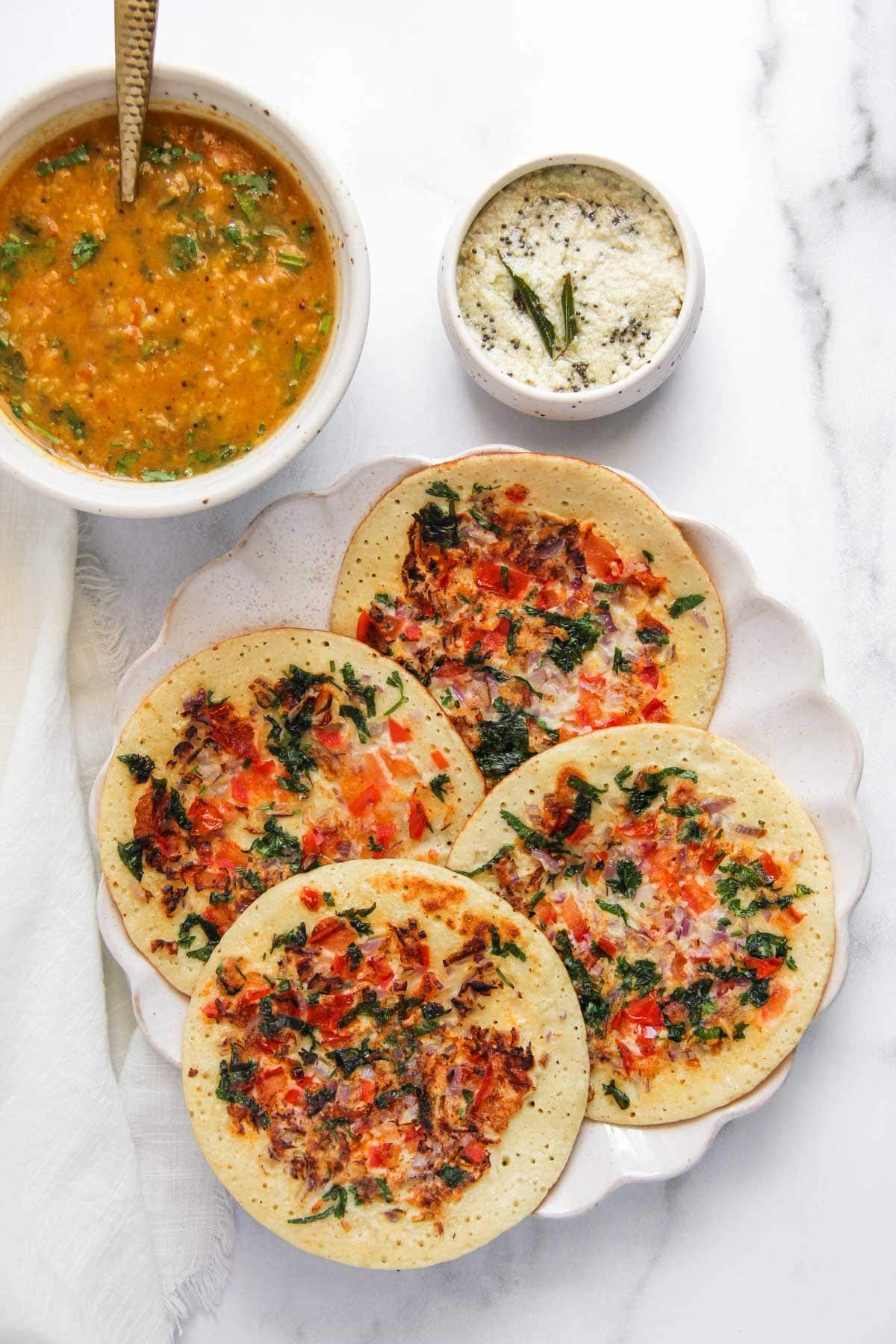 protein Uttapam in a white platter.