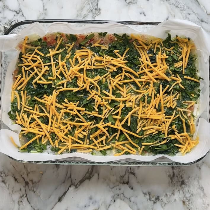 spinach and cheese spread over the egg whites.