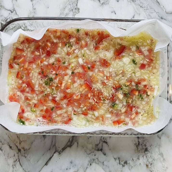 onions, peppers and green chilies on egg whites.