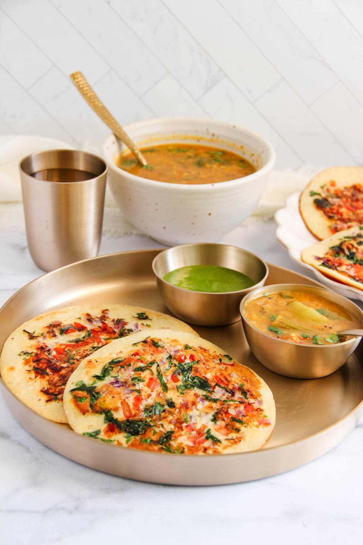 cottage cheese uttapam served with sambar and chutney. 
