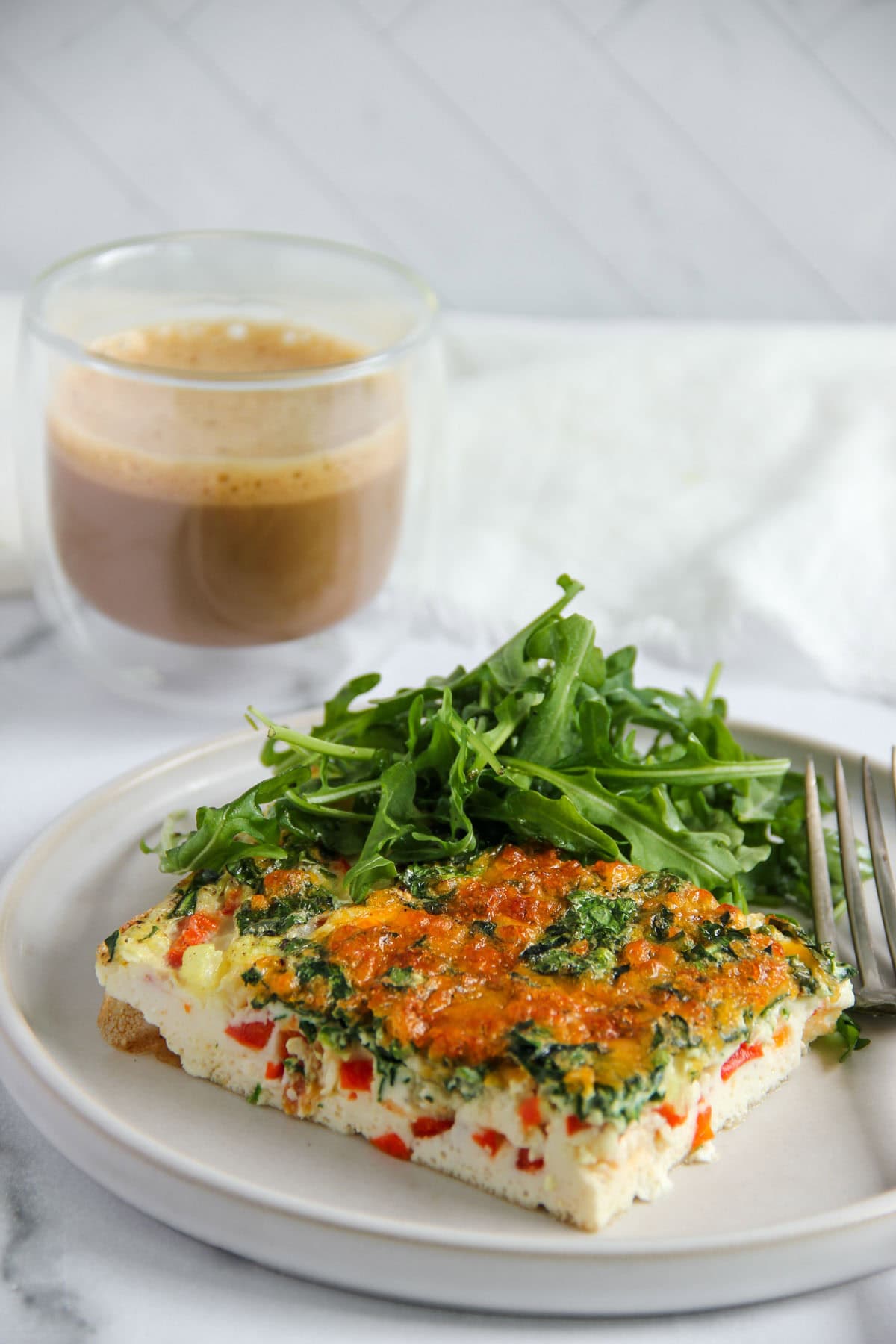 veggie egg whites bake served with arugula salad. 